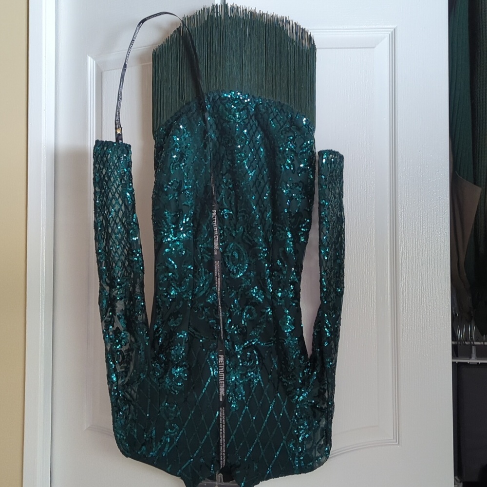 Emerald green sequin long sleeve tassel hem dress